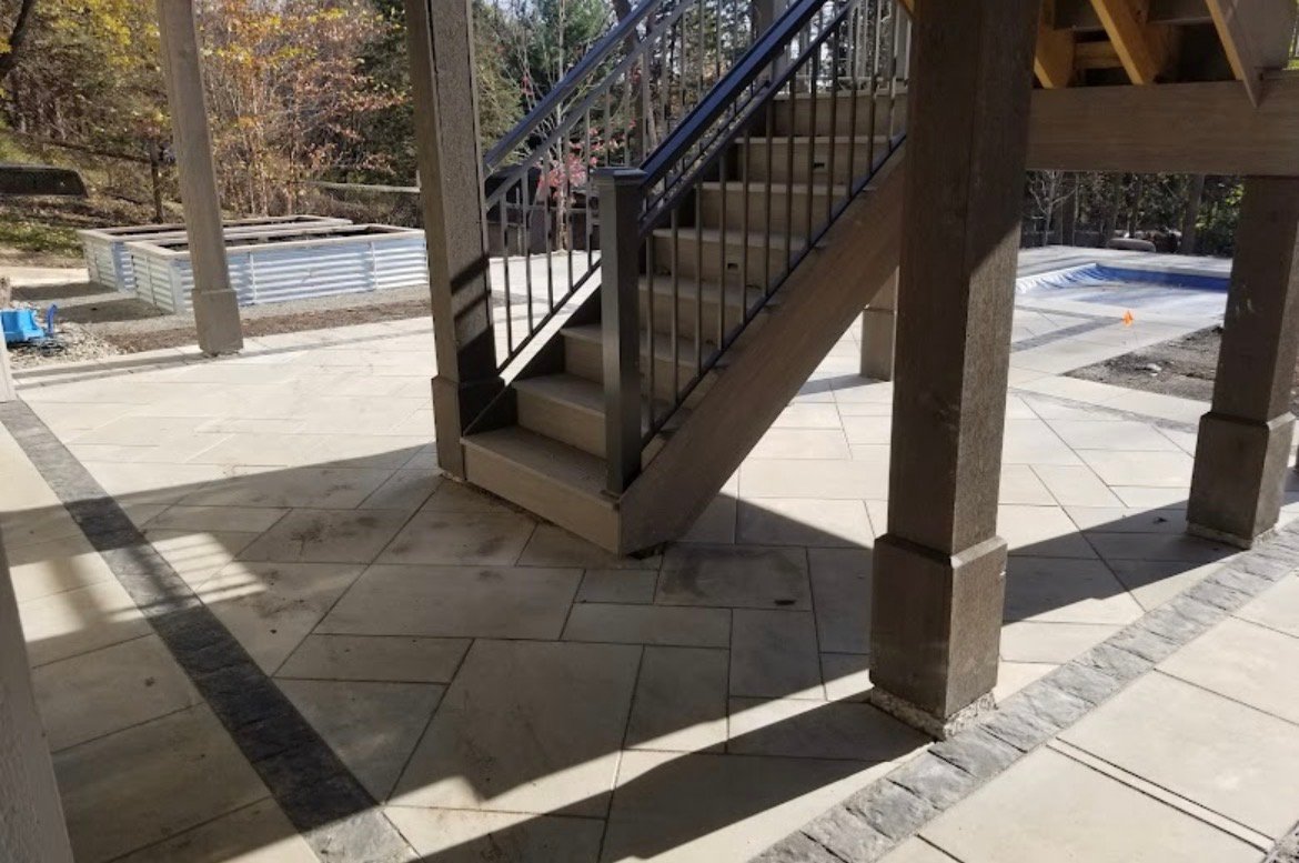 Large format patio and custom stair build — Going Yard hardscaping pool project Edmonton