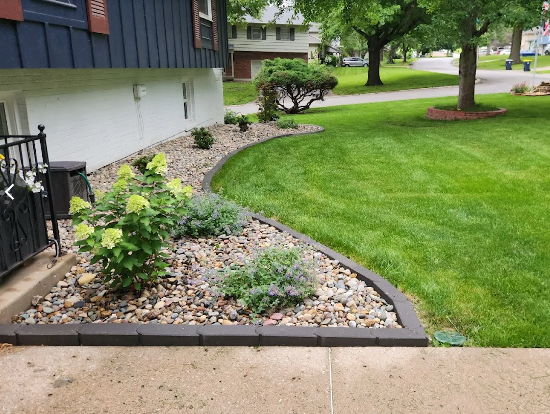 Garden bed edging, river rock mulch and curb appeal refresh — Going Yard landscaping Edmonton