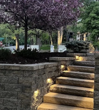 Lit retaining wall and stone stairs — Going Yard Edmonton