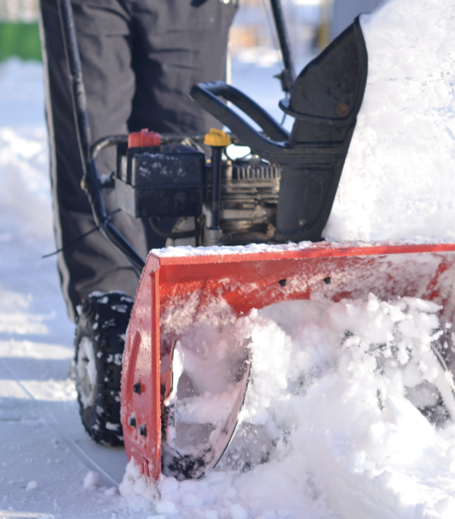 Snow blower clearing a residential driveway — Going Yard
